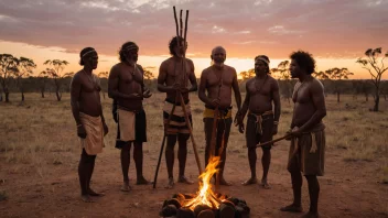 En gruppe aboriginer fra Australia samlet rundt et tradisjonelt bål, med en didgeridoo-spiller i sentrum, mot en bakgrunn av den australske ørkenen ved solnedgang.