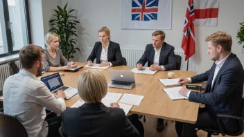 En gruppe mennesker som diskuterer og debatterer rundt et bord med papirer og laptoper, med et norsk flagg i bakgrunnen.