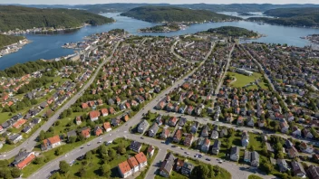 Flyfoto av Skjetten bydel med boligområder, handelsaktiviteter og offentlige transportforbindelser.