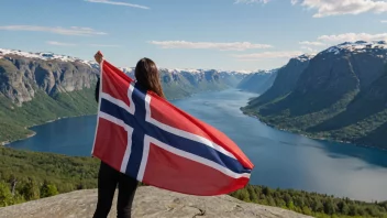 En person holder stolt et norsk flagg, med en vakker fjord-landskap i bakgrunnen.