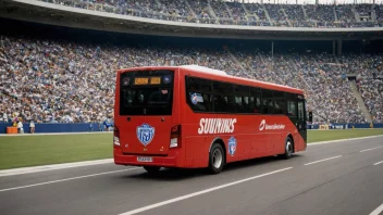 En spillerbuss kjører til stadion.