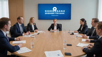 En gruppe mennesker i et møterom, som representerer en sparebankforening, med en stor logo av en norsk bank i bakgrunnen.