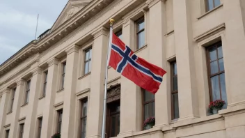 Osloambassaden med et norsk flagg som vifter i forgrunnen.