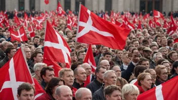 En arbeiderpartitilhenger holder et flagg og deltar i en demonstrasjon.