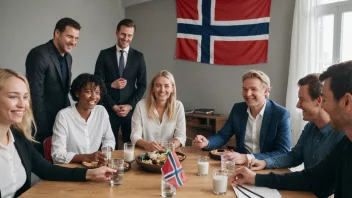 En gruppe mennesker fra ulike kulturer samlet rundt et bord, smiler og chatter, med et norsk flagg i bakgrunnen.