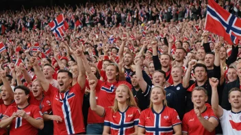 En gruppe mennesker kledd i rødt og hvitt, som heier og vifter med norske flagg