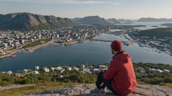 En person fra Bodø, med en naturskjønn utsikt over byen i bakgrunnen.