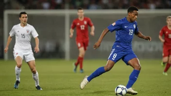 Et actionfylt idrettsbilde som viser en fotballspiller i luften, mens han sparker ballen.