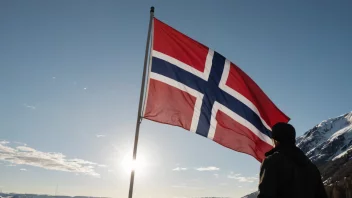 Et norsk flagg som vifter i vinden, symboliserer nasjonal stolthet og respekt.