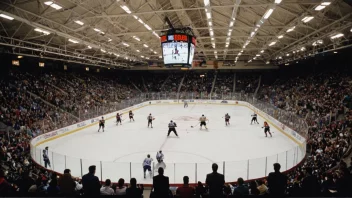 Et stort innendørs isstadion med en ishockeykamp i gang.