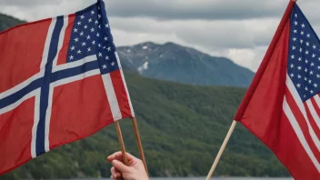 En person som holder et norsk flagg, med et amerikansk flagg i bakgrunnen.