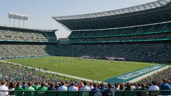 Et stort utendørs stadion med en grønn gressbane og en folkemengde som ser på en sportsbegivenhet.