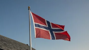 Et norsk flagg vifter i vinden, symboliserer landets motstand og styrke.